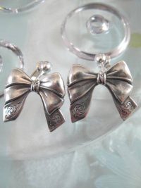 Clips örhängen med silver Rosetter